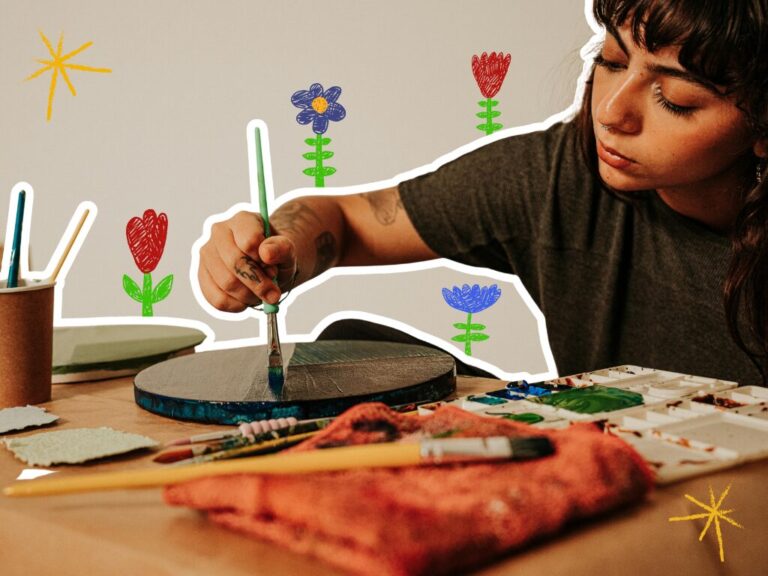 Person drawing with hand drawn flowers around them